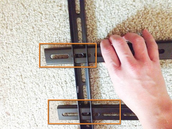 Center the TV mount plate on the horizontal lengths.