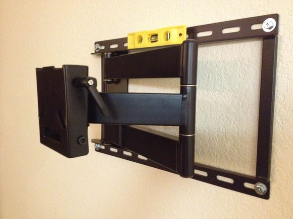The TV wall mount should be level and firmly secured to the wall.