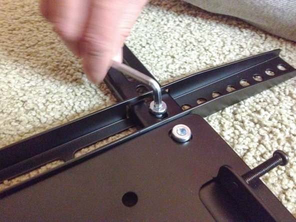 To complete the assembly of the TV mounting bracket secure the TV mounting bracket with a screw in each corner.