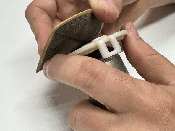 Remove the factory pump filter, retainer and lower isolator.