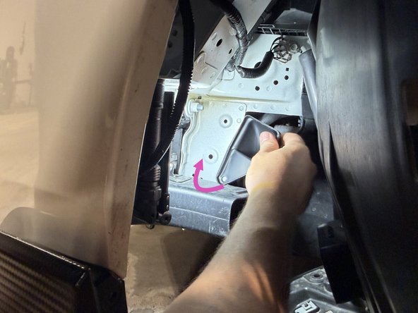 Install the lower section fully behind the bumper beam with the mounting hole pointing down. Once it's in, turn it clockwise until the hole lines up, and secure it. The push-in clip goes into the existing chassis hole.