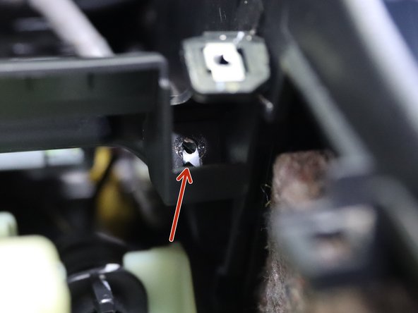 There are (x2) Phillip screws holding the front section of the console to the lower dash. They are hard to see and remove, but must be removed before the console can separate. The  red arrows in images 2 and 3 identify their location.