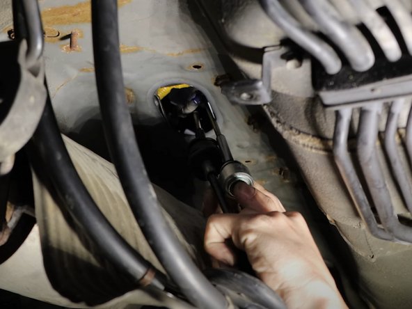 Then, pull the cables upward from the engine bay.