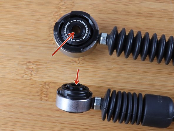 You can now install the shifter cables back on the transmission. Use the supplied great and apply it on the gear selector pin.