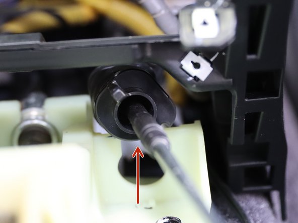 Once it spins, slide it upwards removing it from the shifter.