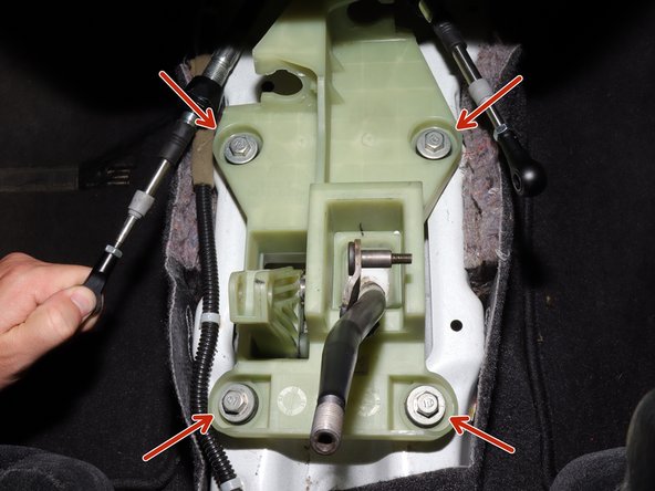 Remove the four shifter mounting bolts.