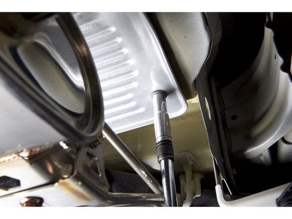 You should only need to remove the LH side bolts. Once they are loose, you should be able to pull it downward.