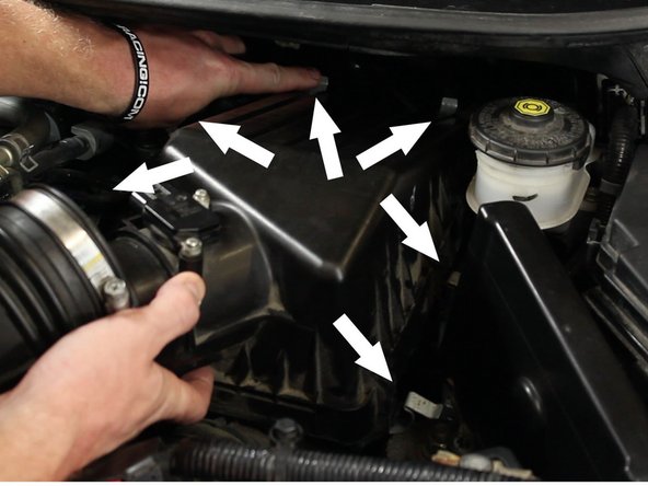 Unhinge the air box lid. There are six hinges total.