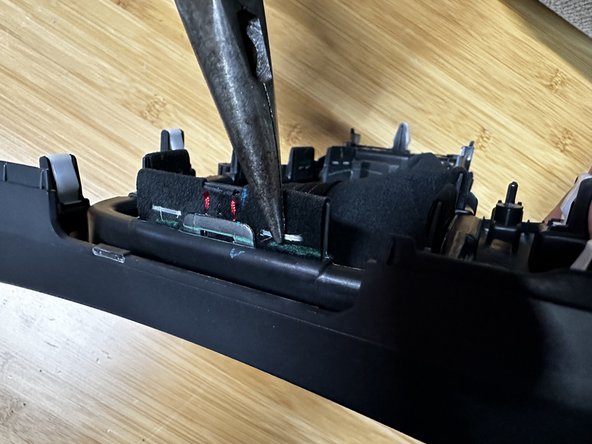 Once you have space, you can use a pair of needle nose pliers to pull them out. Remove all of the staples.