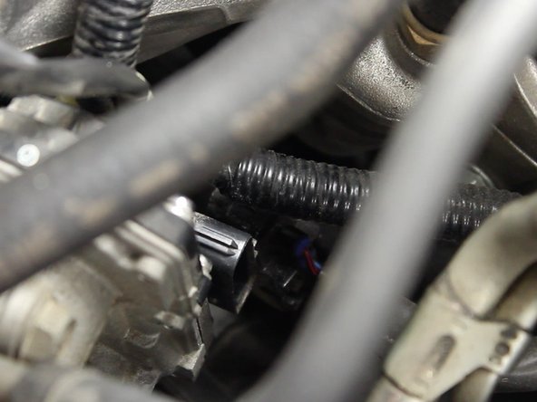 Unplug the throttle body harness plug.