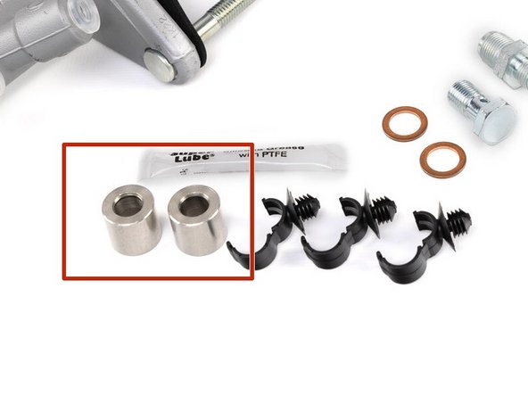 Install the mounting spacers and secure the CMC with the factory 12mm nuts.