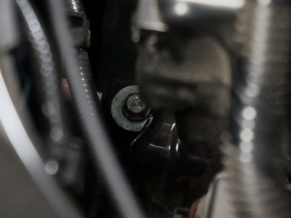 Remove the lower airbox base by unbolting the 10mm mounting bolts.