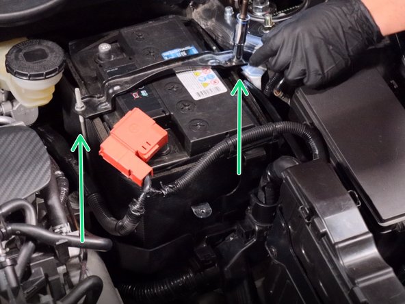 Unbolt the battery tie down.