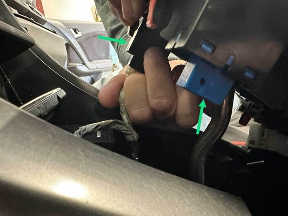 Once free, you can tilt the panel to reveal the switch plugs; disconnect the wiring from the switches before completely removing the panel.