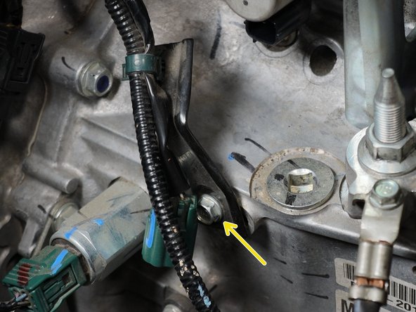 Remove the wire harness mounting bolt on holding on the harness bracket.