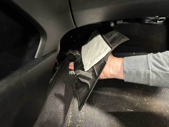 Repeat for the driver side lower console pocket.