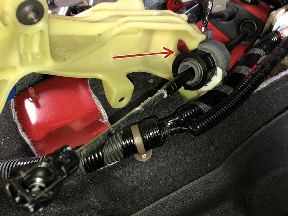 Repeat the process in step 7 and remove the RH side cable from the shifter. Unlock it, spin it, slide it out.