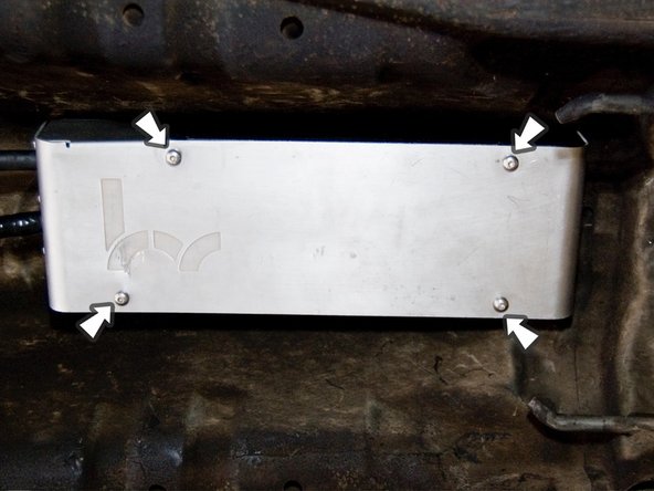 Bolt the debris shield that you removed earlier back onto the shifter.