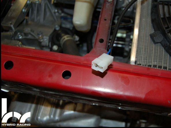 Locate the factory fan connector located near the stock OE radiator fan was. The easiest way to connect the fan is to use the crimp on connectors, remove the stock plug and crimp on the wire connector ends.