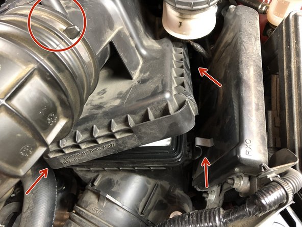 Unsnap the airbox cover and remove it completely from the car.