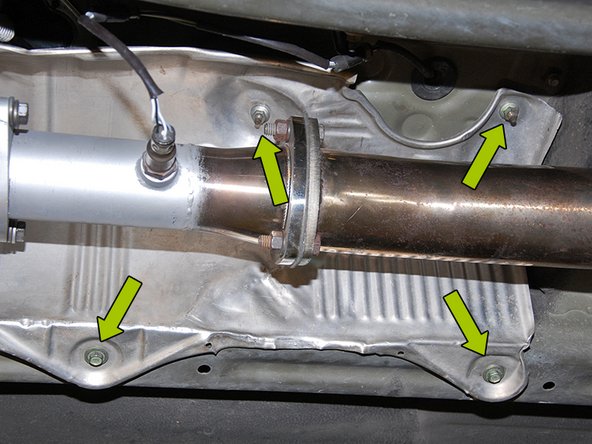 Next you will need to remove the heat shield for the exhaust Using a 10mm socket or nut driver, remove the (4) M6  bolts and (2) nuts pictured and rotate the heat shield  out from behind the exhaust(Fig 3A/3B).