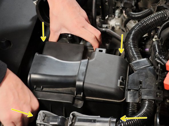 Unscrew the upper airbox lid. There are four screws that hold it in place.