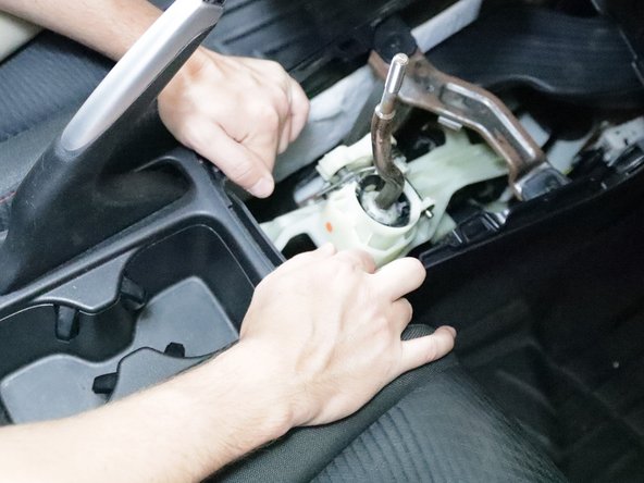 Use your hands and pull upwards on the upper console trim. This can be tough if it has never been removed before.