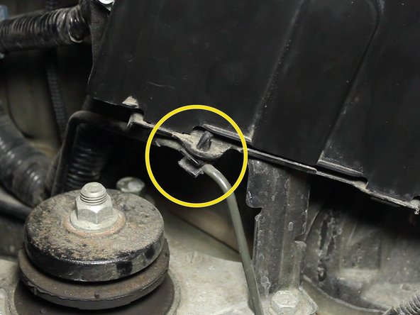 Locate the three mounting locations for the factory clutch line. Un-clip them all now.