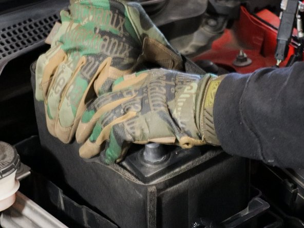 Remove the battery, heat shield and unbolt the lower battery tray.