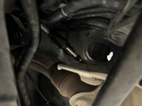 From underneath the car, push/pull cables into the cabin.