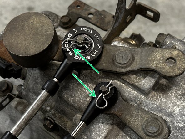 Note the orientation of the shifter cable end link. Make sure the Hybrid Racing logo is facing up and the insert is flat against the gear selector.