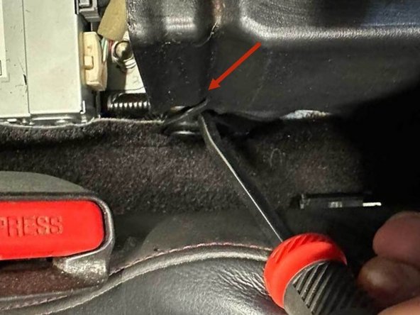 Slide the passenger AC vent back and out of the center of the car.