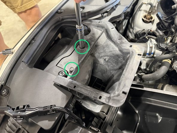 Unbolt the air cleaner case (4 bolts total).