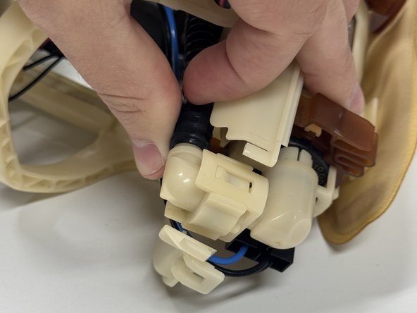 Unclip and remove the fuel pump hose.