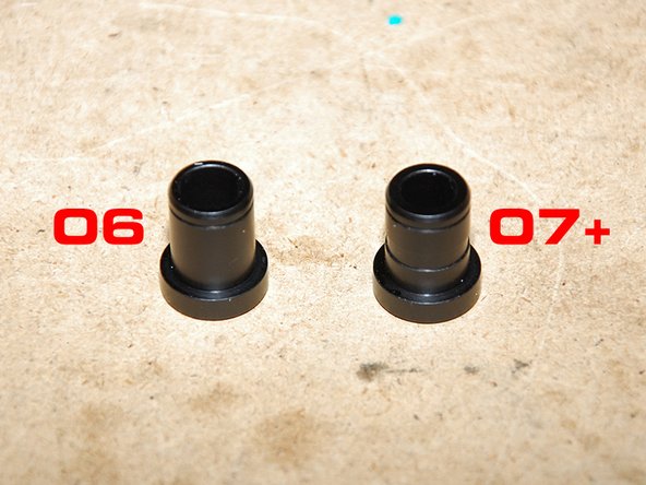 Now install the bushing insert into the larger endlink for the transmission side of the cables.