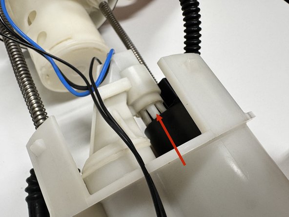 Slide the pump assembly into the housing. You may need to add a drop of lube to the o-ring so it slides into place easily. Push the pump into the housing until it stops.