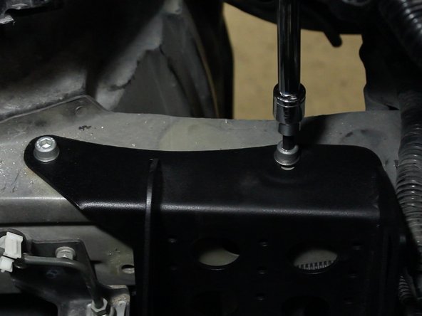 Using the supplied bolts, thread in and tighten the battery tray in place.