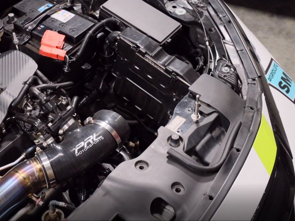 Pull the coupler off and remove the airbox from the car.