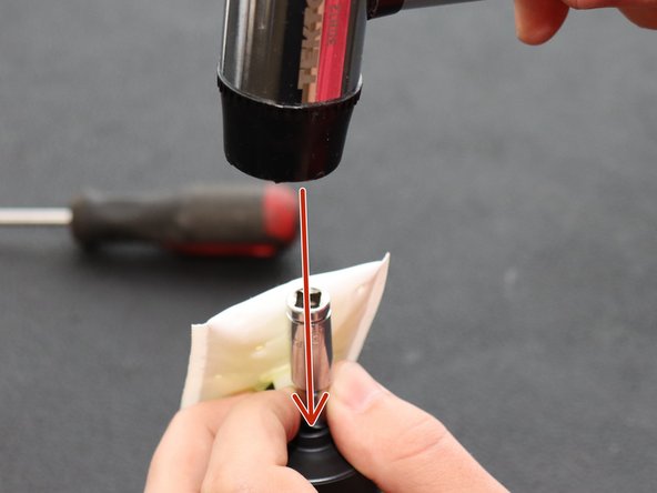 If you can push it on with your hands, do that before using a hammer. Be careful not to break anything. Tap gently.