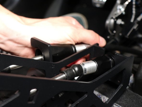 Inside the car, attach the cables to the shifter.