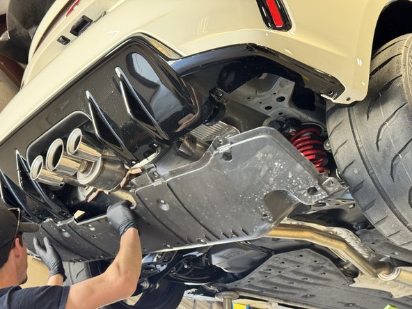 Then slide the other side out and set the panel aside. You should not have full access to the muffler and hangers.