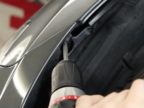 Remove the screws that fasten the bumper to the fender bracket. There is one on each side. You may have to pull back the fender lining to gain access.