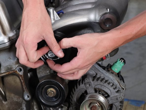 Align the logo and use the supplied bolt.