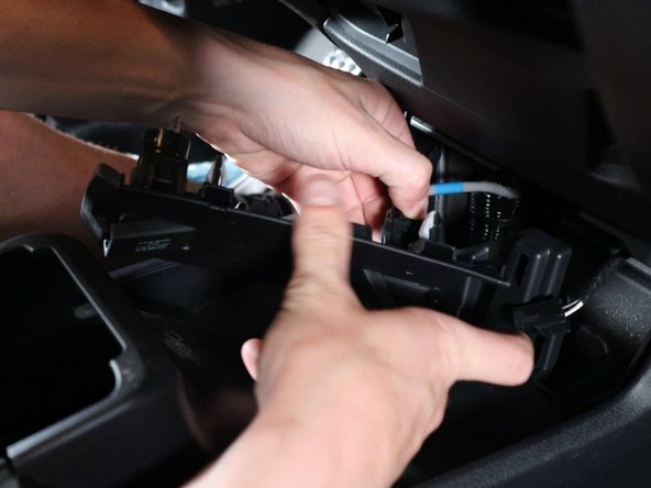 Unplug them all and remove the panel from the car.