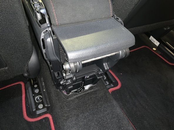 Once the cover comes off, unplug the keyless entry connector and remove the clip holding the harness in place.