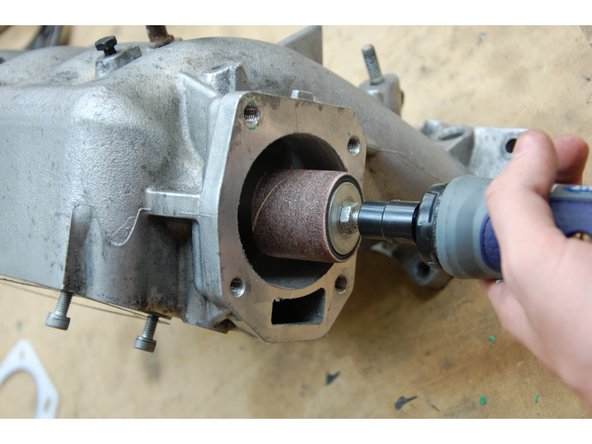 Be sure to remove any old gasket material from the mounting surface. If you are using a new intake manifold, disregard this step.