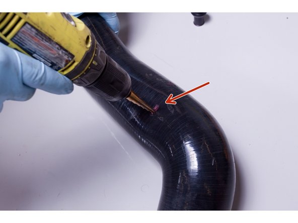 Using the supplied vacuum fittings as a guide, drill holes in the intake tube where you marked. Be sure to start with a smaller hole before going larger. It is always possible to enlarge a hole, it is impossible to make it smaller once it has been drilled.