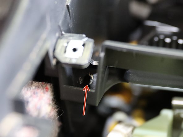 There are (x2) Phillip screws holding the front section of the console to the lower dash. They are hard to see and remove, but must be removed before the console can separate. The  red arrows in images 2 and 3 identify their location.