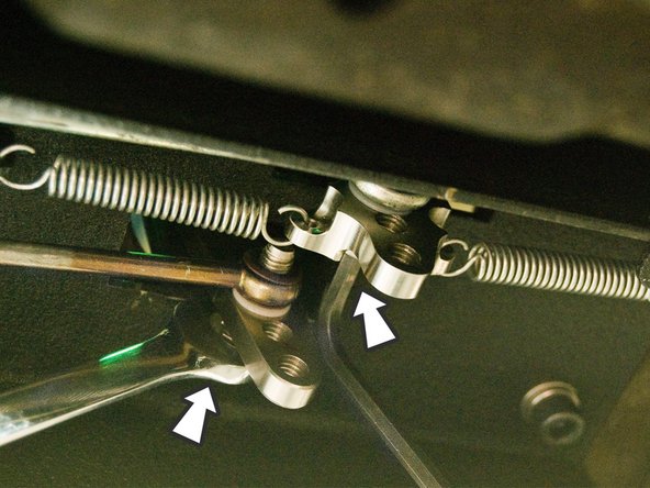 Adjust the cable retaining bolt for the cable controlled by the front/back motion using a 5mm allen wrench.
