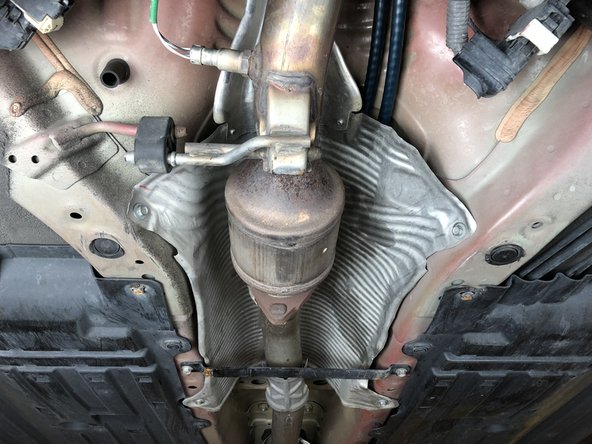 Reinstall the exhaust heat shield and make sure it is not contacting the cables in any way.